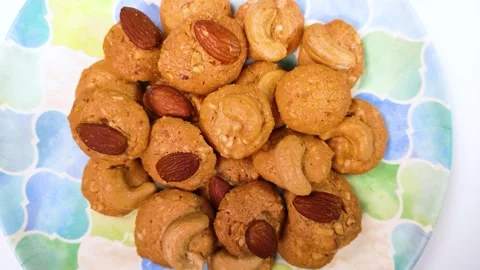 Nut cookies on a plate, rotating Stock Footage 302038829