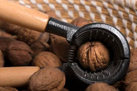 Nut cracker in a basket with wallnuts Stock-Fotos