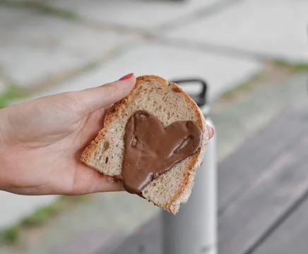 Nut cream on bread slice Stock Photos