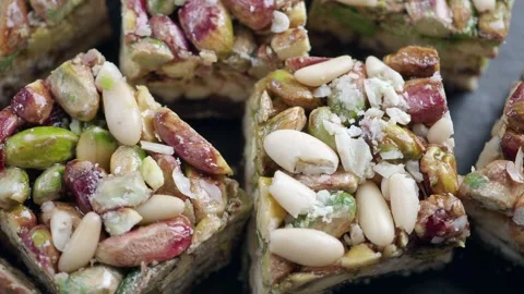 Nut dessert made with nuts and sugar syrup in a kitchen Stock Footage 342384574