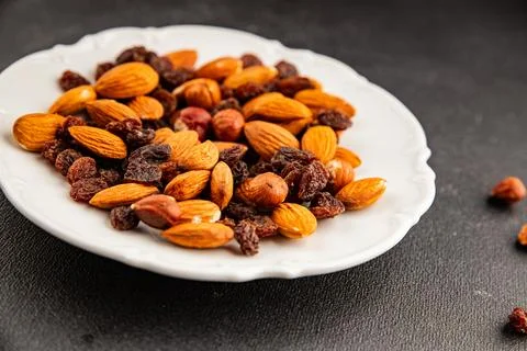 Nut mix assorted nuts almonds, raisins, hazelnuts healthy eating nutritious.. Stock Photos