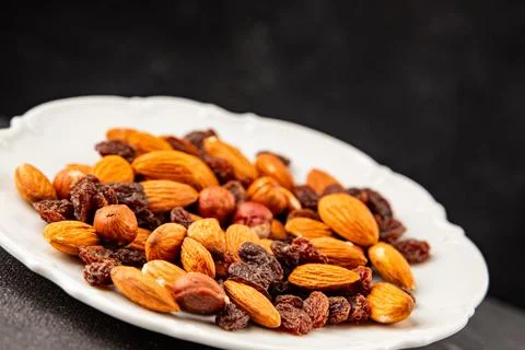 Nut mix assorted nuts almonds, raisins, hazelnuts healthy eating nutritious.. Stock Photos