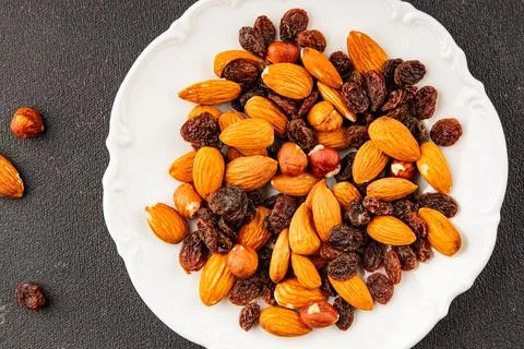 Nut mix assorted nuts almonds, raisins, hazelnuts healthy eating nutritious.. Stock Photos