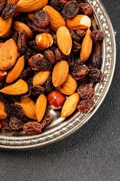 Nut mix assorted nuts almonds, raisins, hazelnuts healthy eating nutritious.. Stock Photos