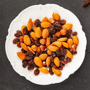 Nut mix assorted nuts almonds, raisins, hazelnuts healthy eating nutritious.. Stock Photos