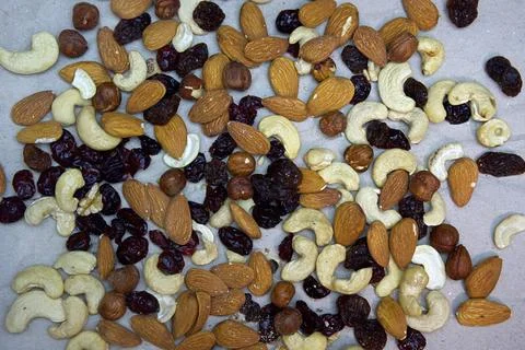 A nut mix consisting of various types of nuts and dried fruits. Stock Photos