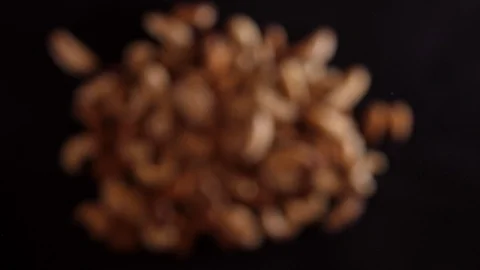 Nut mix fly up and down on a black background. Cooking healthy food with nut mix Stock Footage 126699755