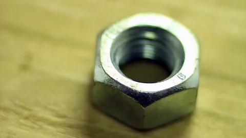 Nut rotates on the plate Stock Footage 74067190