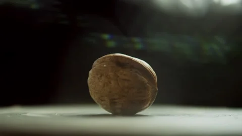 A Nut On A Spinning Surface Explodes When Hit With A Sledgehammer Stock Footage 255701596