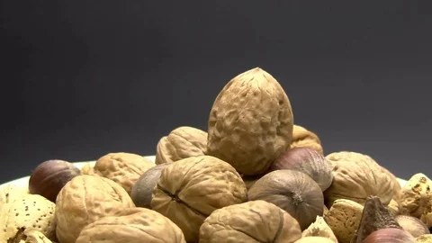 Nutcracker Almost Crushing Walnut in Shell on Black Slow Motion Stock Footage 70377123