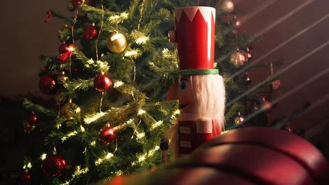 Nutcracker and Christmas tree over the Red Armchair Stock Photos