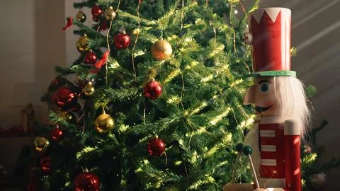 Nutcracker and Christmas tree over the Red Armchair Stock Photos