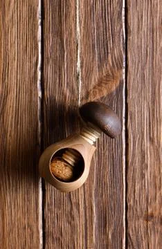 Nutcracker and walnut on a wooden background Stock Photos