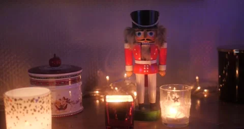 Nutcracker christmas decoration standing in candle light. Stock Footage 168319296