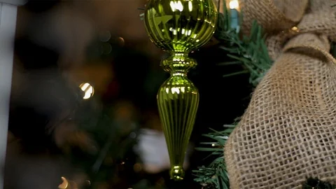 Nutcracker Christmas ornament hanging from a decorated tree.   Stock Footage 99352407