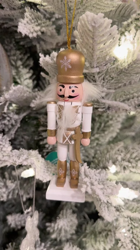 Nutcracker Christmas ornament hanging on tree, wooden decor Stock Footage 329584443
