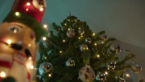 Nutcracker with christmas tree and lights background Stock Footage 255596129
