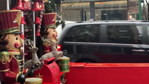 Nutcracker figures are set up along New York City sidewalk during holiday season Stock Footage 147294290