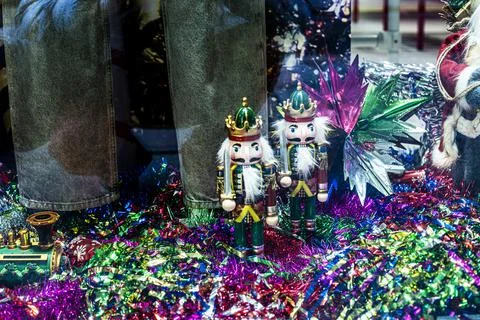Nutcracker figurines among bright New Year's decorations in the clothing de.. Stock Photos