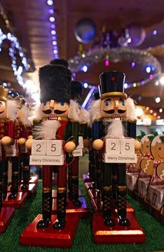 Nutcracker figurines holding christmas advent calendar on display Stock Photos