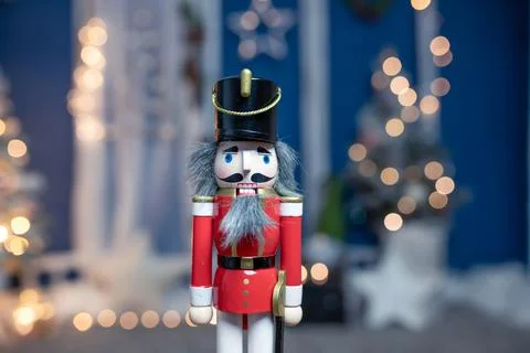 Nutcracker with holiday lighting background Stock Photos