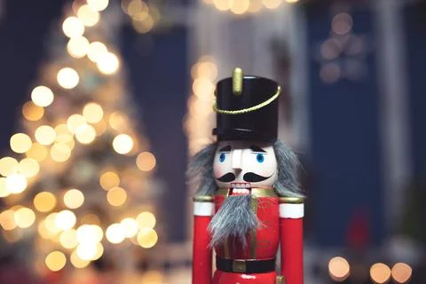 Nutcracker with holiday lighting background Stock Photos