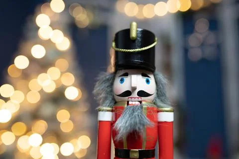 Nutcracker with holiday lighting background Stock Photos