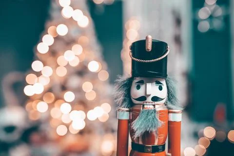 Nutcracker with holiday lighting background Stock Photos