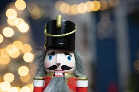 Nutcracker with holiday lighting background Stock Photos