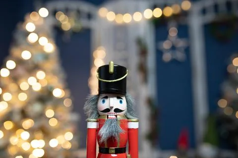 Nutcracker with holiday lighting background Stock Photos