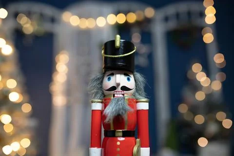 Nutcracker with holiday lighting background Stock Photos