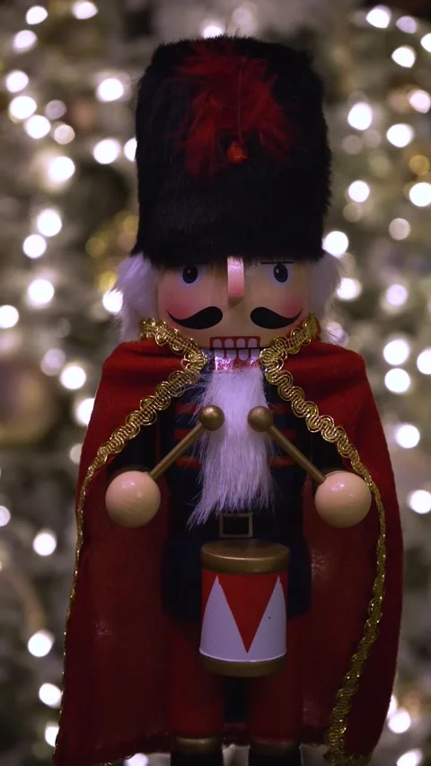 Nutcracker Ornament Among Snowy Pine Branches Stock Footage 327338243