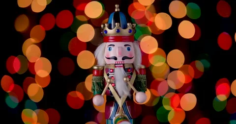 Nutcracker Soldier against bokeh of festive vintage backdrop Christmas lights Stock Footage 295280519