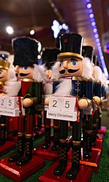 Nutcracker soldier dolls holding merry christmas countdown calendar Stock Photos