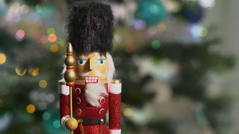 Nutcracker soldier in front of Christmas tree Stock Footage 144251174