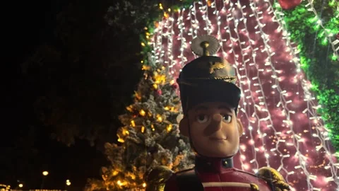 Nutcracker Toy Soldier Display Against Christmas Lights Stock Footage 322850176