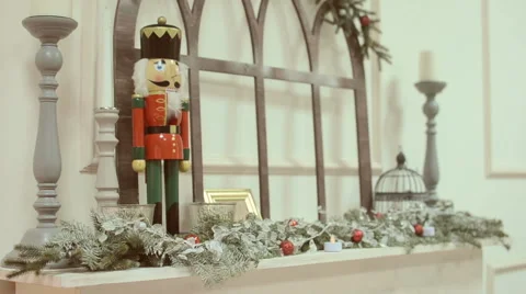 Nutcracker toy , standing on the mantelpiece. Stock Footage 58620372