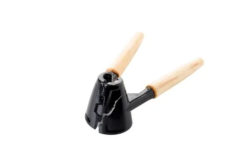 Nutcracker with wooden handle is broken. Stock Photos