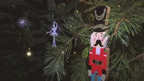 Nutcrackers hanging on Christmas tree. The Nutcracker figurine was hanging Stock Footage 225855976