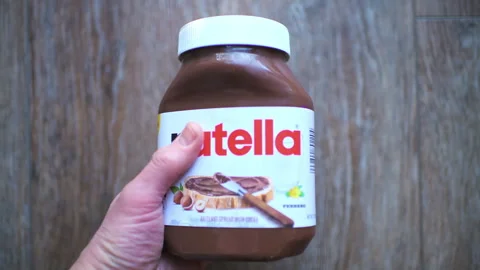 Nutella chocolate hazelnut spread paste, sweet Italian food Stock Footage 330298476