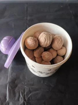 Nutmeg in a Container Stock Photos