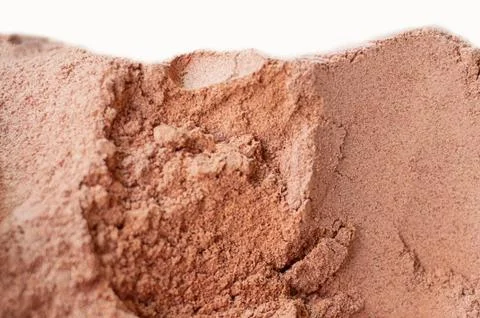 Nutmeg powder as a background. Stock Photos