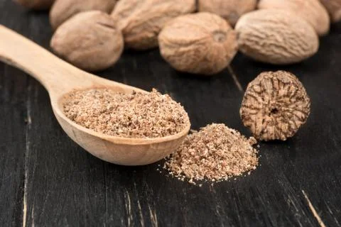 Nutmeg powder in spoon Stock Photos