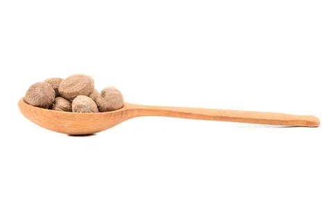 Nutmeg in spoon Stock Photos