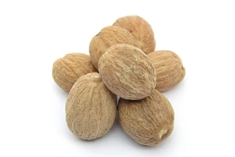 Nutmeg on white background close-up view  Stock Photos