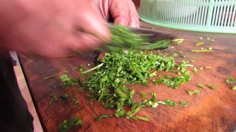 Nutritionally high leaf vegetable cutting for preparation. Stock Footage 133543538
