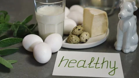 Nutritious breakfast ingredients that prominently feature eggs and dairy product Stock Footage 310171573