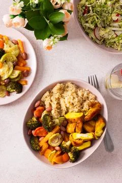 A nutritious breakfast spread includes quinoa, baked sweet potatoes, carrot.. Stock Photos
