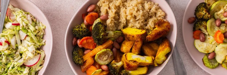 A nutritious breakfast spread includes quinoa, baked sweet potatoes, carrot.. Stock Photos