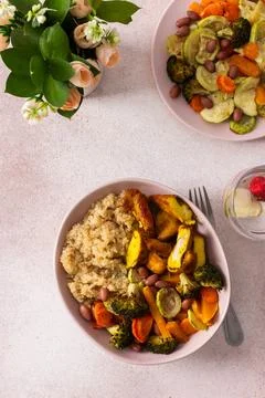 A nutritious breakfast spread includes quinoa, baked sweet potatoes, carrots, Stock Photos